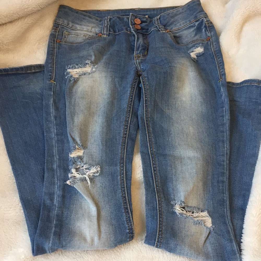 Mid rise ripped bootcut jeans